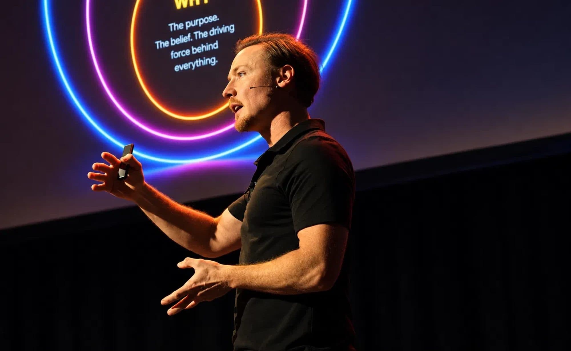 Brad Hook on stage, mid-keynote